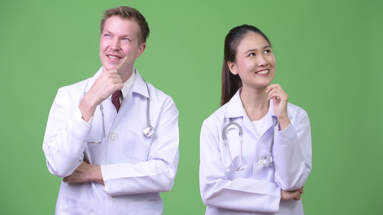 Multi-ethnic couple doctors thinking together