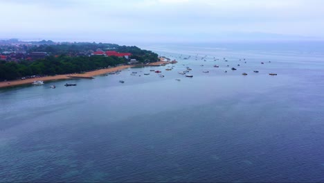 sabur bay with traditional jukung fishing boats in bali island, indonesia