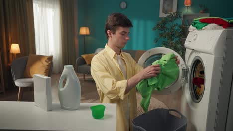 young man doing laundry