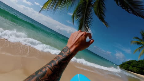 pov surfing on a tropical beach