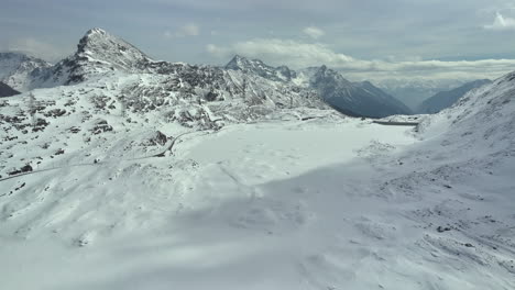 Frozen-water-reservoir-in-the-Swiss-alps-on-a-sunny-day