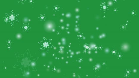 flor de copo de nieve y seis estrellas seis ramas ala de espina cayendo en la pantalla verde, partículas de polvo de hielo elemento para el festival de navidad fondo verde