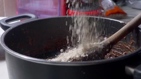 Close-up-footage-of-preparation-of-healthy-energy-bars,-made-with-couverture-chocolate-and-cereal