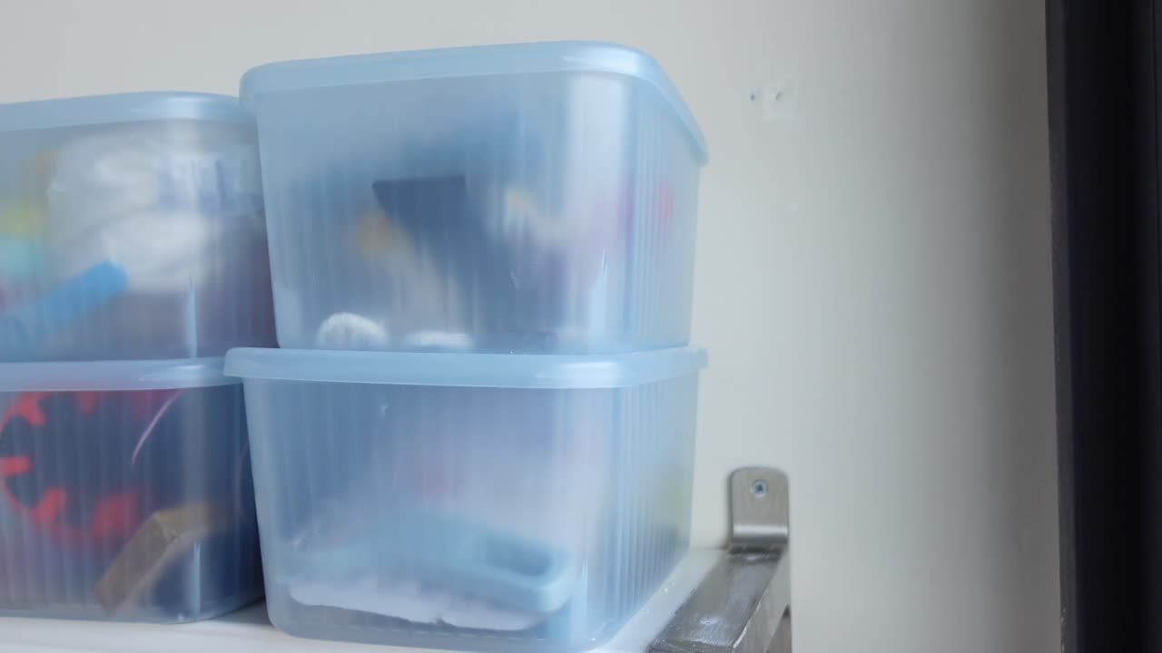 Storage containers on a shelf