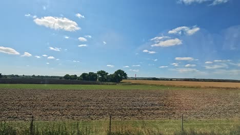 expansive fields under a clear blue sky