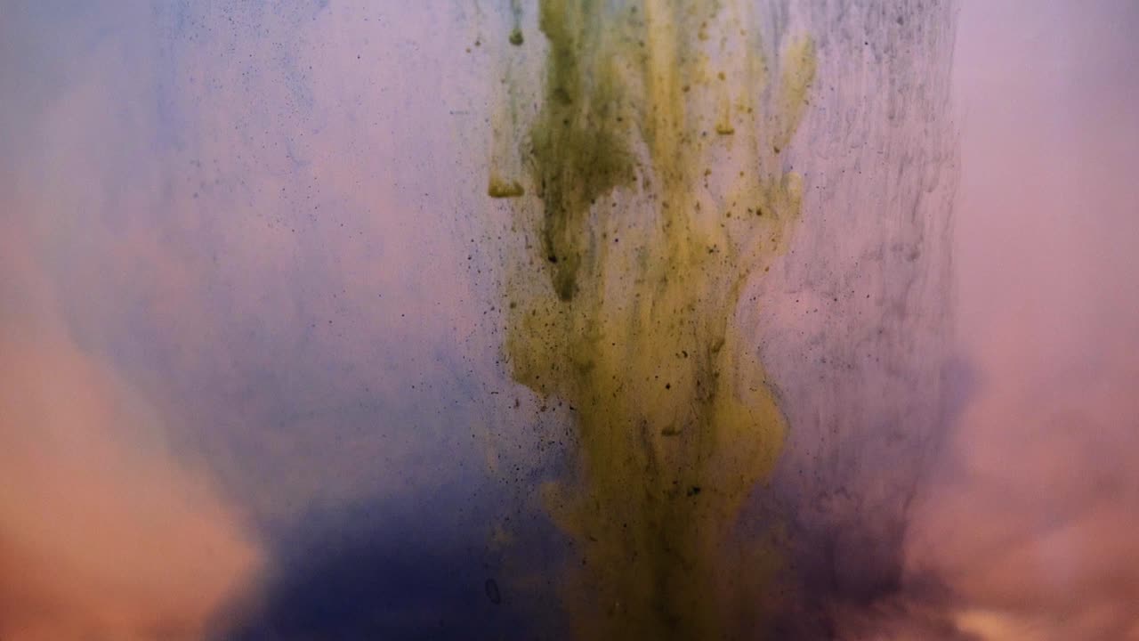 Slowmotion colored paint floating in water tank. Stable shot with the Sony a7iii