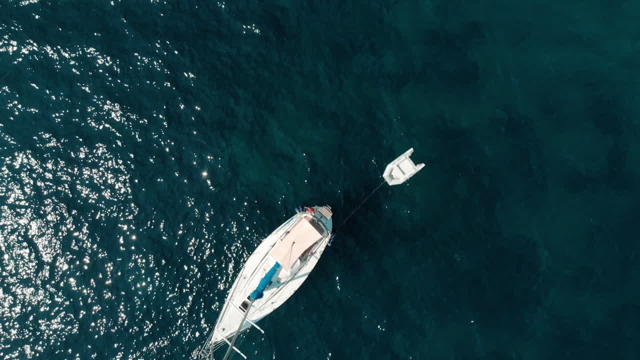 Aerial: Beautiful 4k drone view of Amalfi beach, Italy with Tyrrhenian Sea, mountains and crystal clear blue water