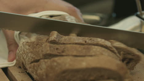 Close-Up-Shot-Bread-Slicing-Into-Small-Pieces