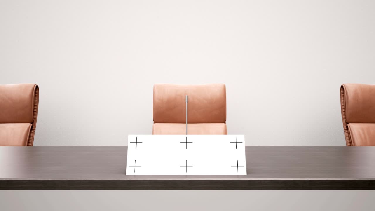 기자회견 테이블, 스피커의 이름판, 갈색 가죽 의자, 카메라 도리, 왼쪽에서 오른쪽으로 슬라이드.