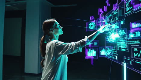 woman interacting with futuristic holographic interface