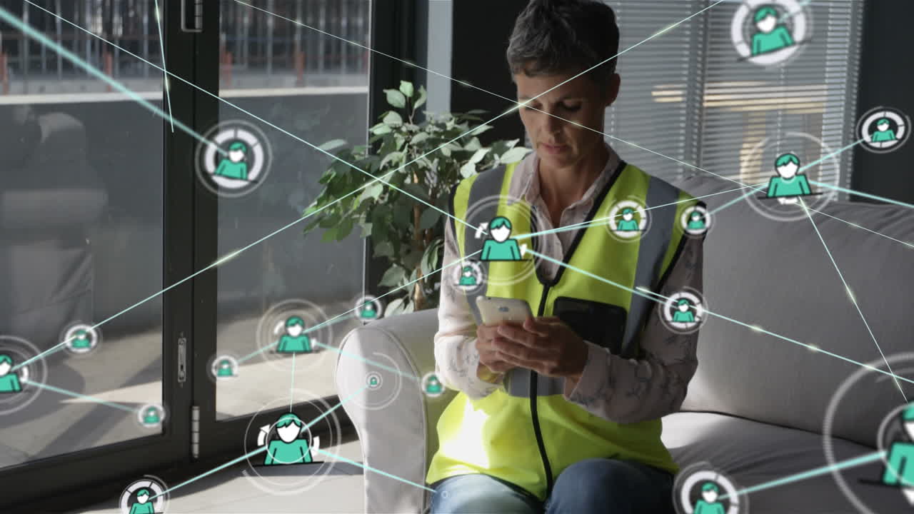 Animation of network of connections with icons over caucasian female architect using smartphone
