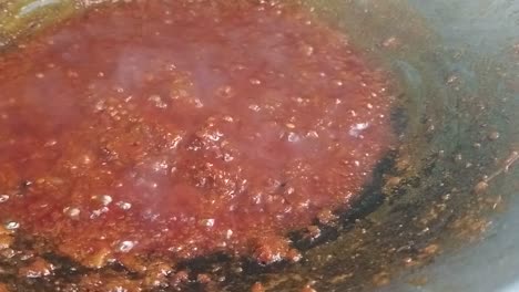 sambal tumis or stir-fried chilli paste is a versatile malay and indonesian condiment in the hot pan which is used for cooking spicy dishes such as added with prawns, egg and stinky beans.