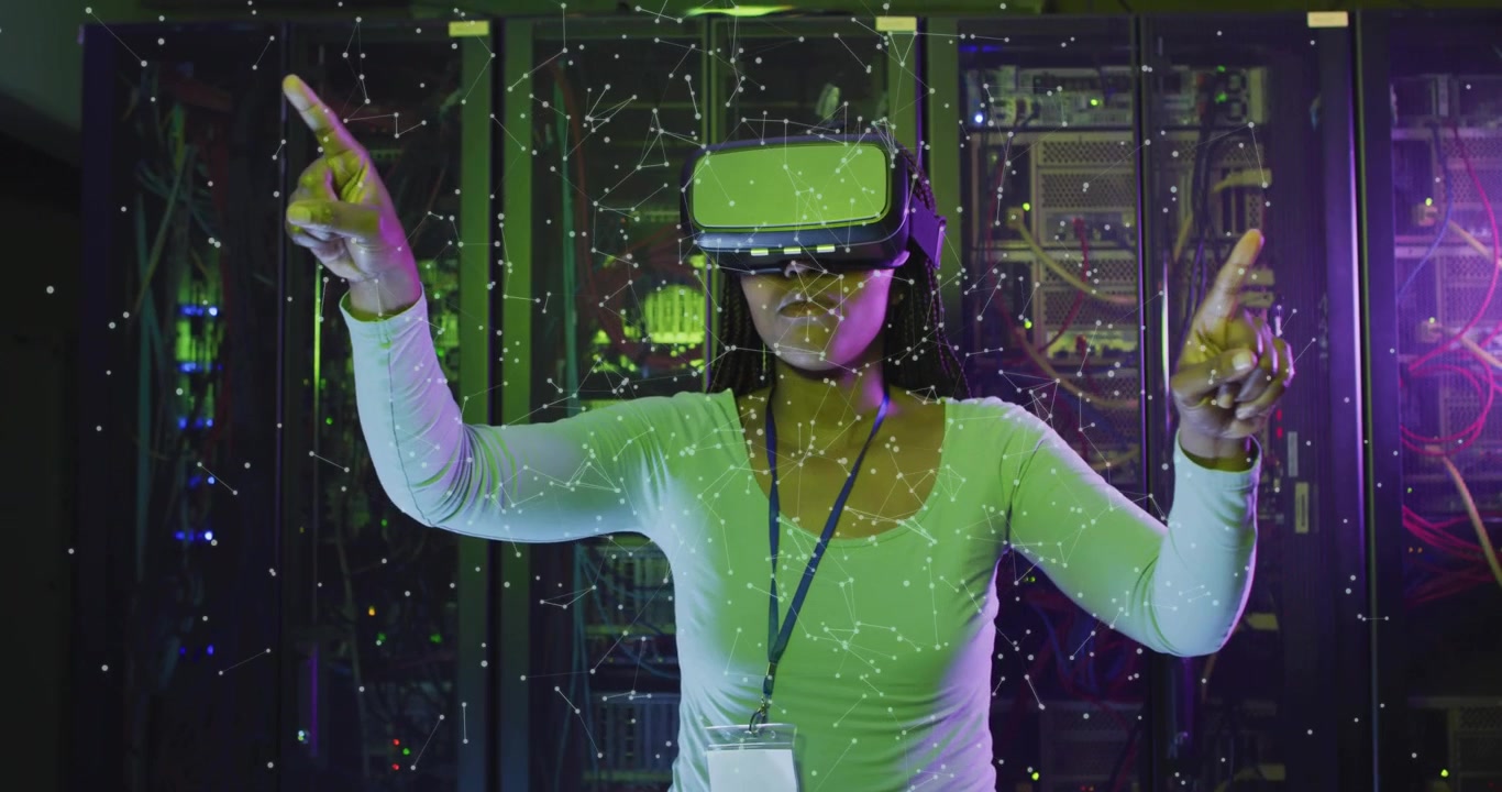 IT woman in VR headset raising hands, causing green overlay, selecting nodes, confirming servers