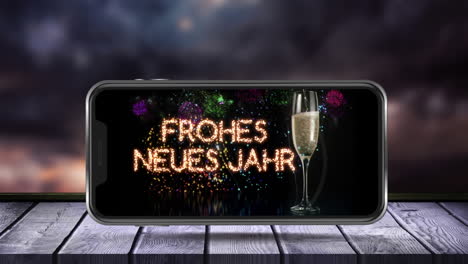 animación de frohes neues jahr texto y copa de champán en la pantalla del teléfono inteligente y fuegos artificiales