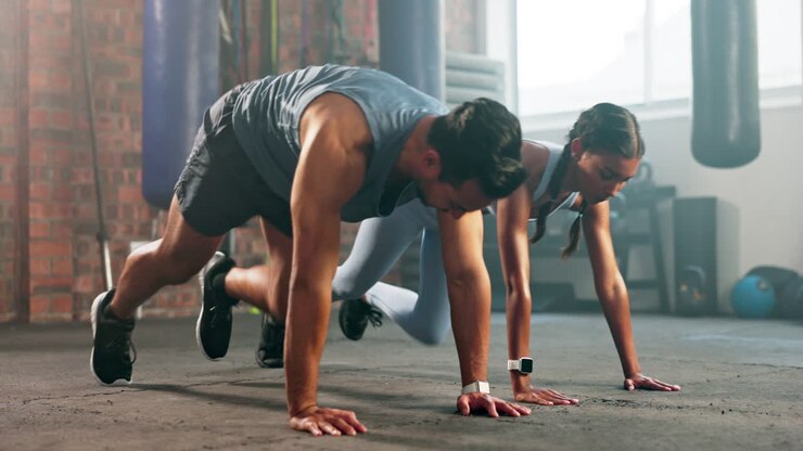 Health, fitness and class with couple in gym
