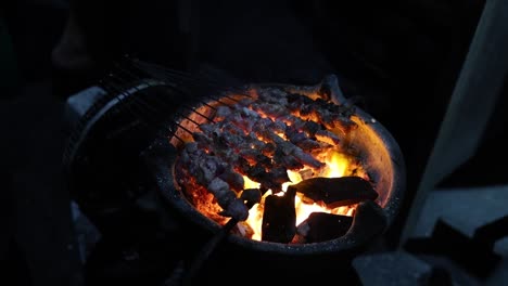 the process of burning goat satay or indonesian klathak satay in the night