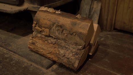 Silver-Birch-logs-stacked-beside-wrought-iron-stove