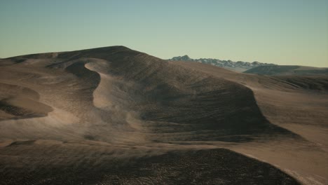 aerial view on big sand dunes in sahara desert at sunrise