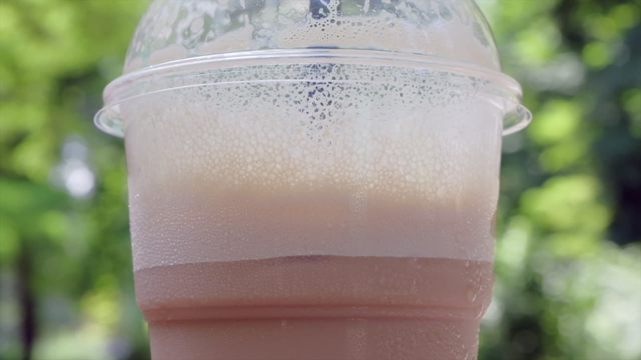 Close up of an iced latte on a table at a terrace