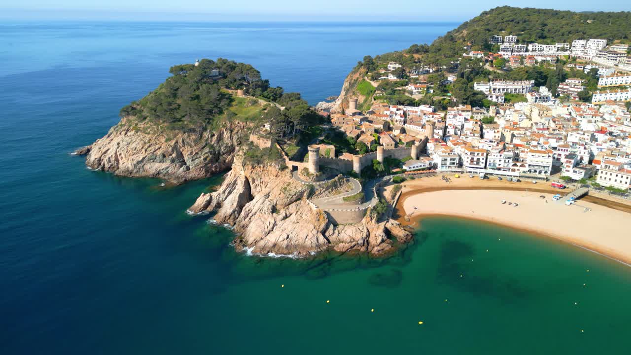 Tossa de mar medieval city walls and beach on costa brava, catalonia