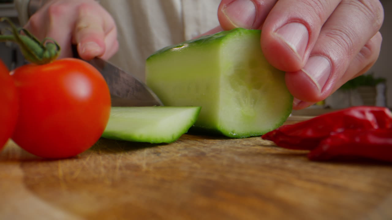 Preparing Cucumber and Tomato Salad
