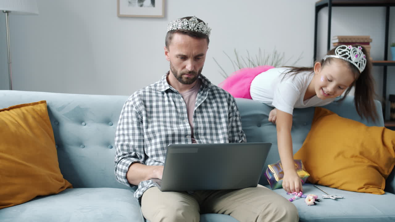 Father Working From Home with Daughter