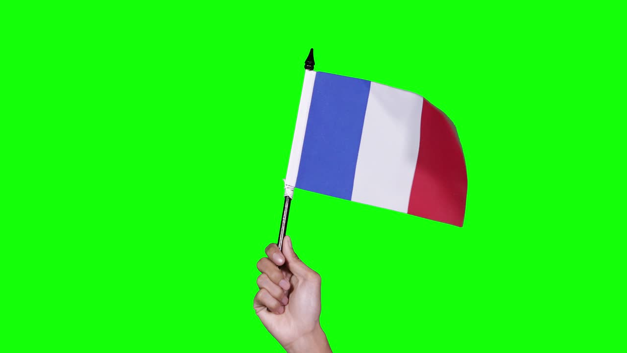 프랑스 발을 흔들고 있는 알려지지 않은 손