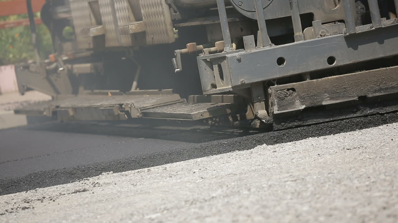 Road Roller Laying A New Asphalt. Road roller building the new asphalt road