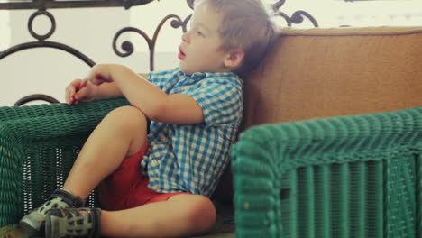 boy sitting in the armchair