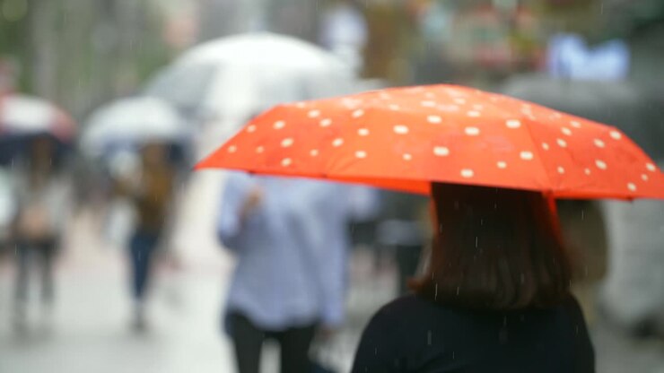 Out of Focus Shot of People in Rain