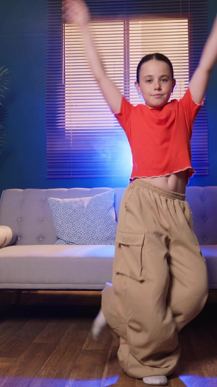 Young Girl Dancing in a Stylish Living Room