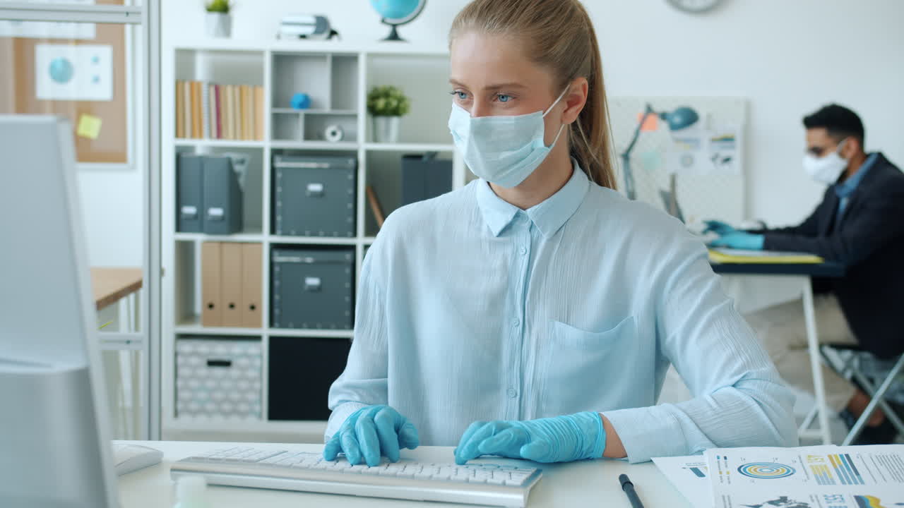 Woman Working in Office During Pandemic