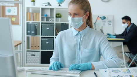woman working in office during pandemic