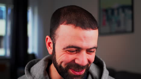 closeup portrait of a cheerful middle eastern caucasian guy smiling in front of camera