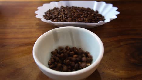 slow motion shot of falling process of mexican coffee beans for weighing