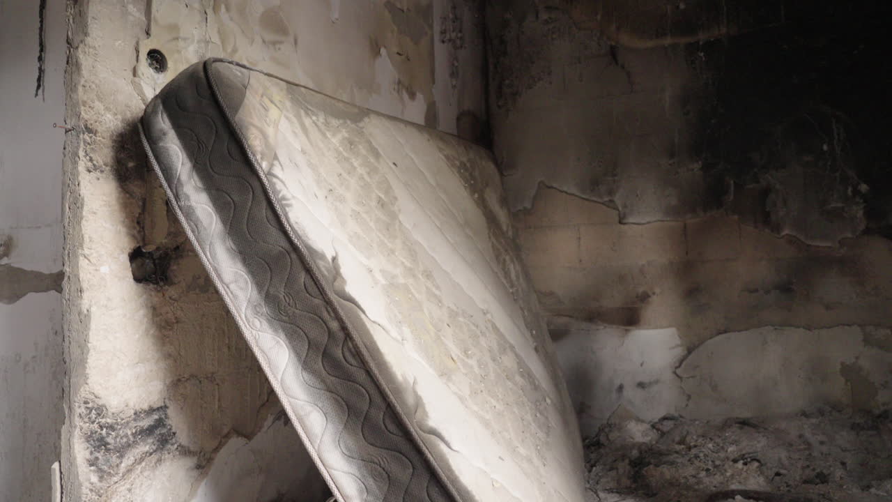 Bedroom mattress destroyed inside a home, Kibbutz Nir Oz, Israel Hamas War