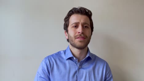 Young-Male-University-Lecturer-Teaching-Video-Lecture-and-Looking-Amused