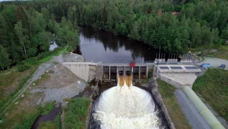 flying towards and over dam, energy supply concept, aerial