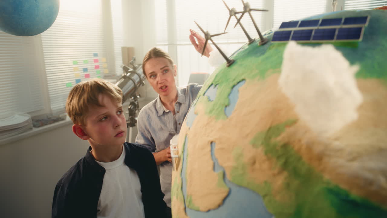 STEM Class on Renewable Energy Female Teacher Explaining Energy Resources to Elementary School