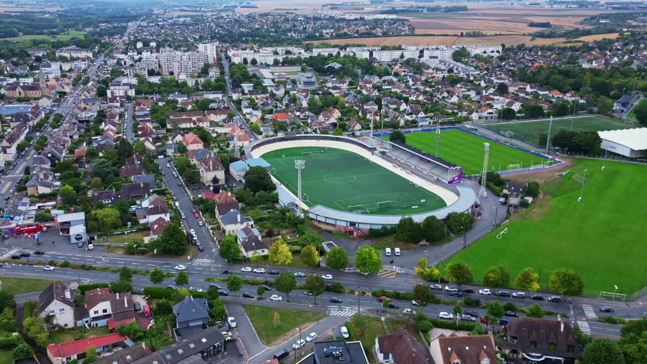 Venois Stadium, Caen, France. Aerial drone forward and cityscape