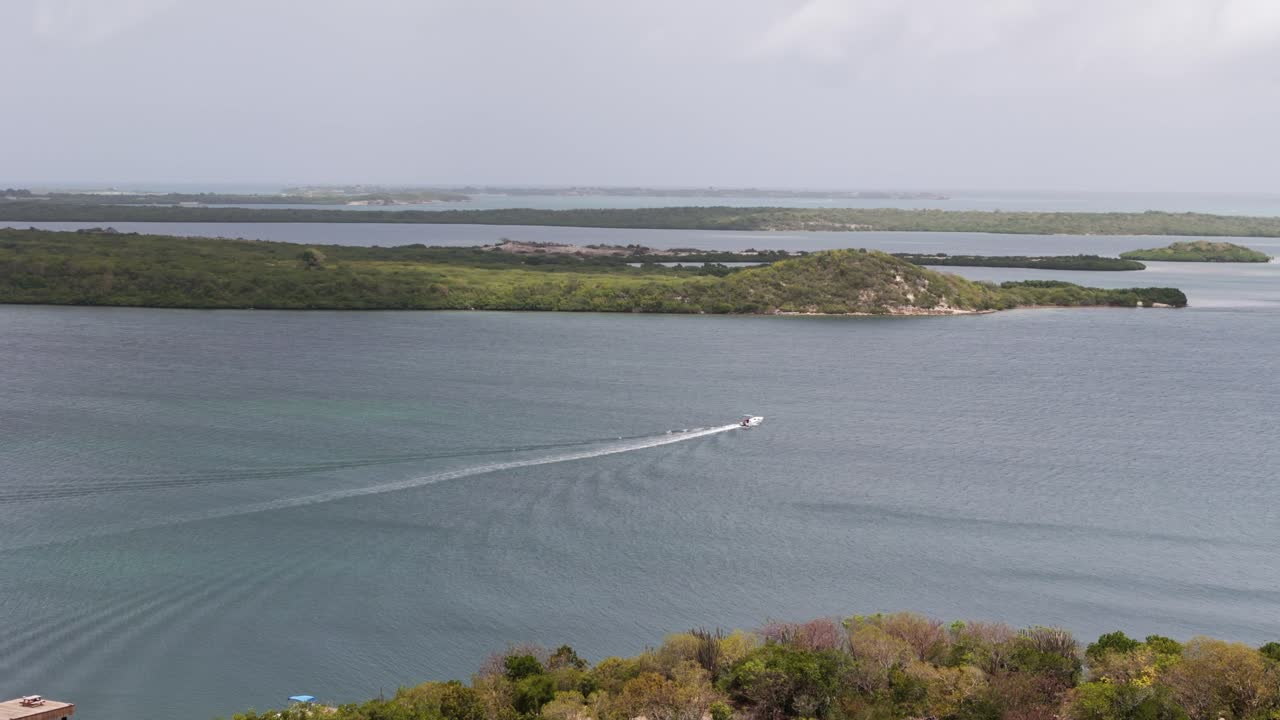 Speedboat Leaving Wake On The Ocean In Antigua And Barbuda - Aerial Drone Shot