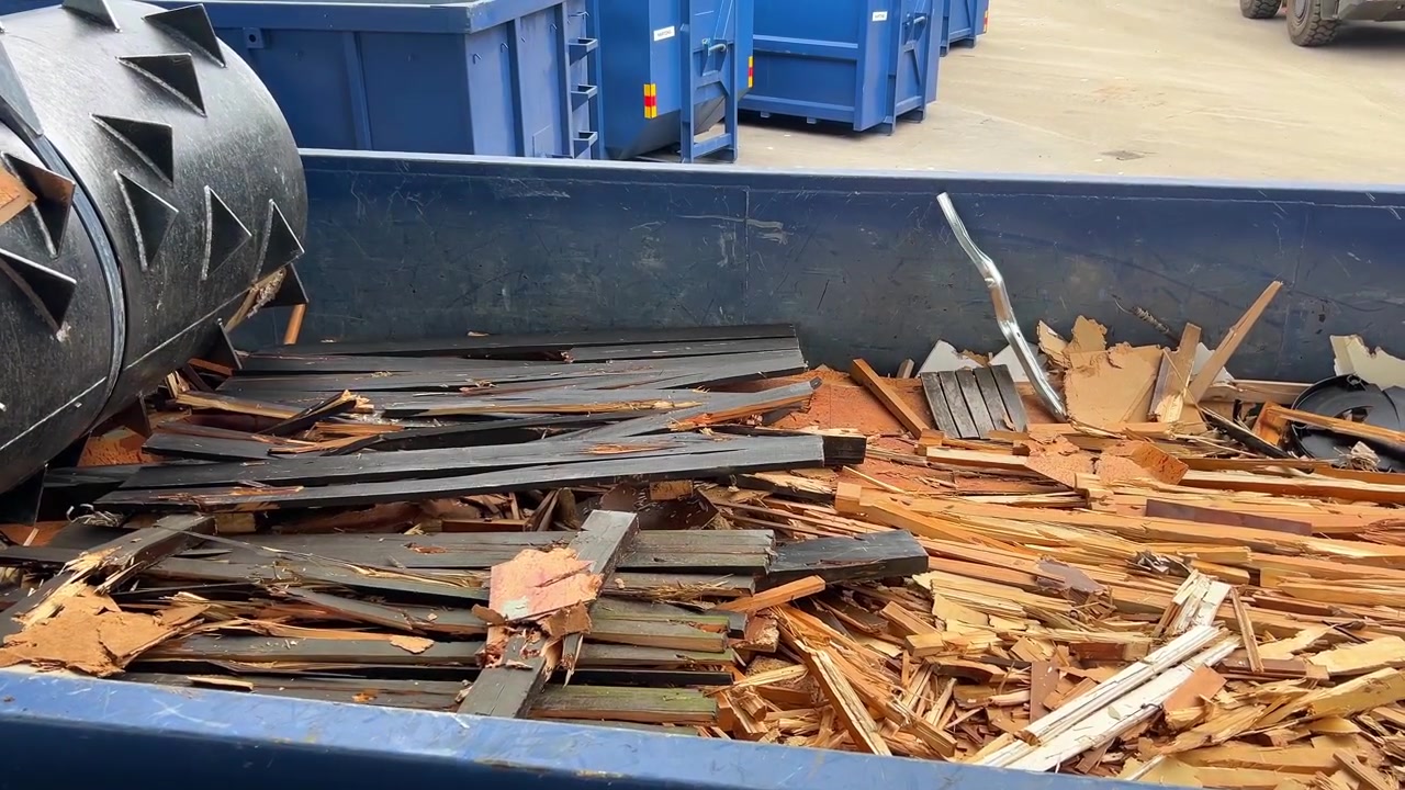Industrial Wood Recycling Crusher Shredding Waste in Dumpster