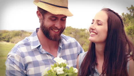 Happy-young-couple-gardening-together