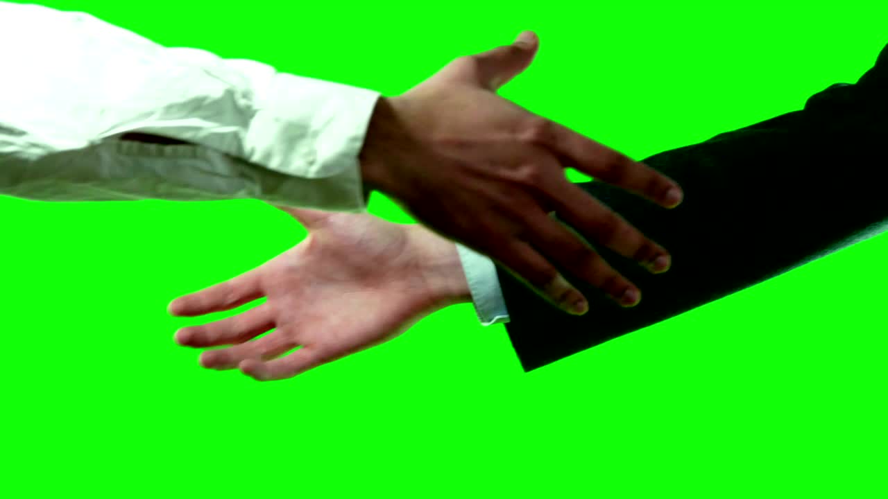 concept de trabajo en equipo de cooperación hombres de negocios estrechando la mano con traje 4k pantalla verde set de video.