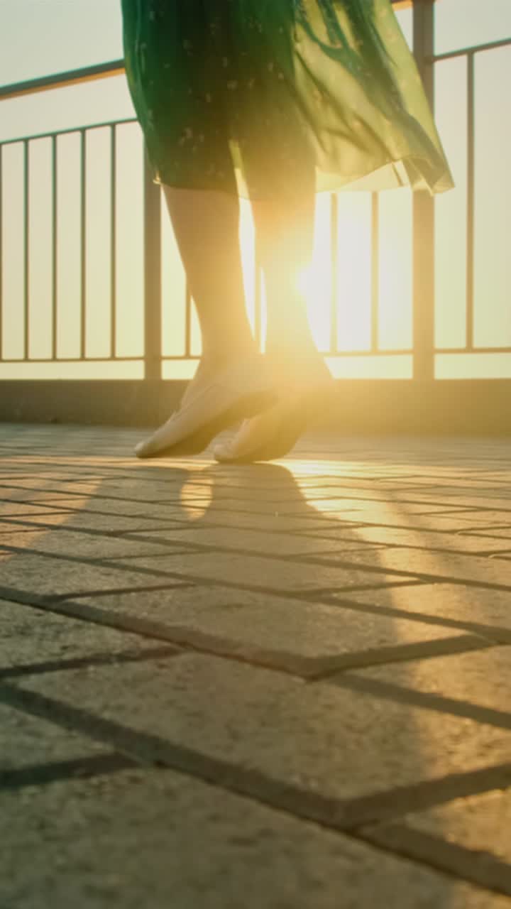 Woman Walking on Balcony at Sunset