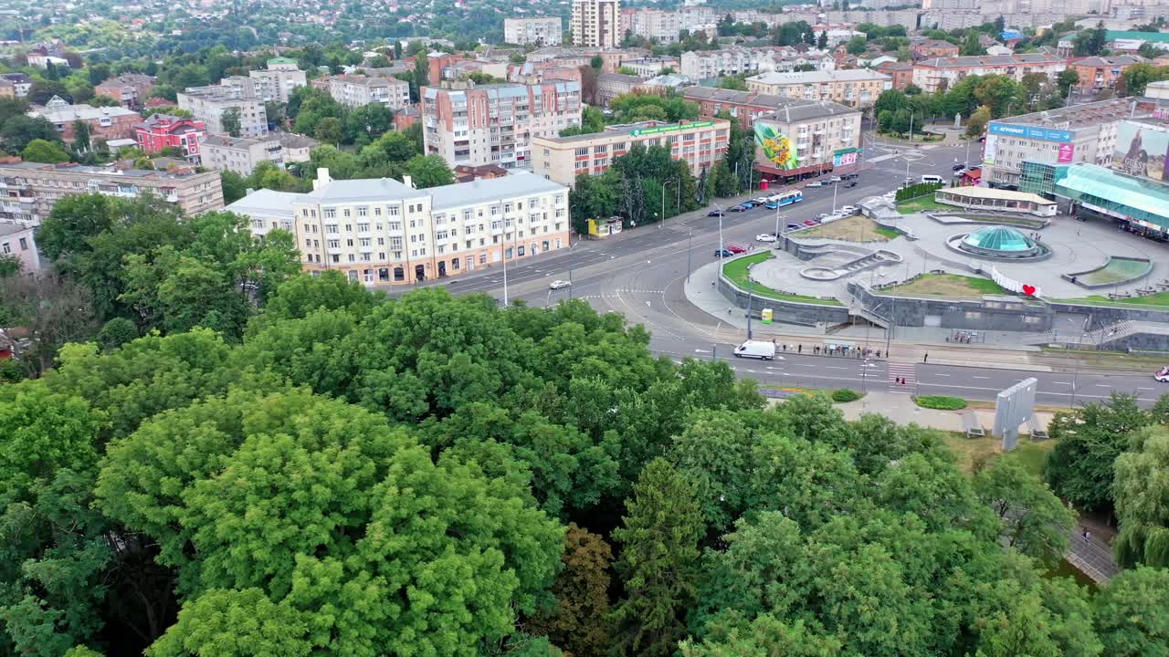 City bird eye view. Aerial view from flying drone of city park with walking path and green zone trees