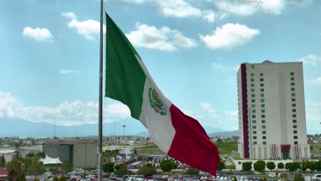 closeup drone footage of the mexican flag