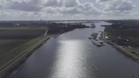 drone shot of small harbor on a river in nature