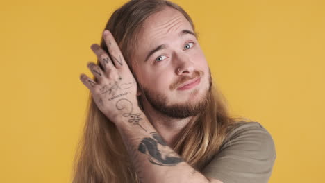 confused caucasian young man in front of the camera.