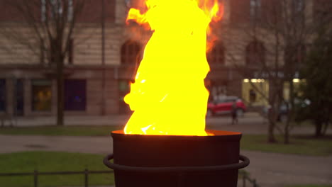 Closeup-view-of-eternal-fire-burning-with-yellow-and-orange-flames